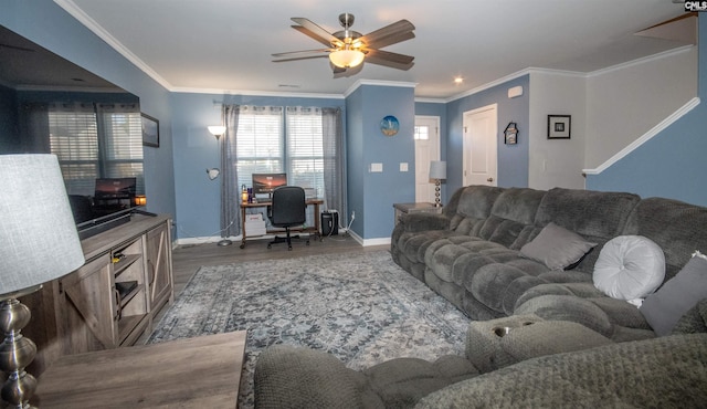 living room with hardwood / wood-style floors, ornamental molding, and ceiling fan