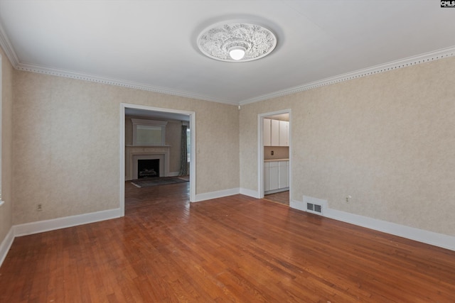 unfurnished room with wood-type flooring and ornamental molding