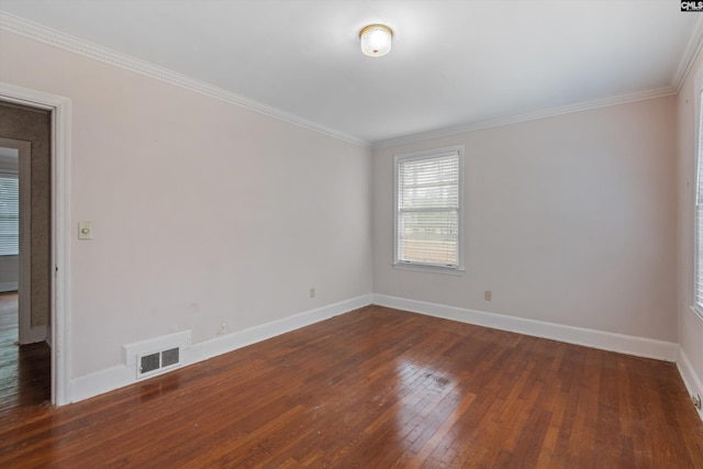 unfurnished room featuring ornamental molding and dark hardwood / wood-style floors