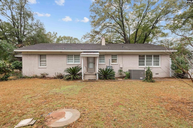 ranch-style house featuring central AC unit and a front lawn