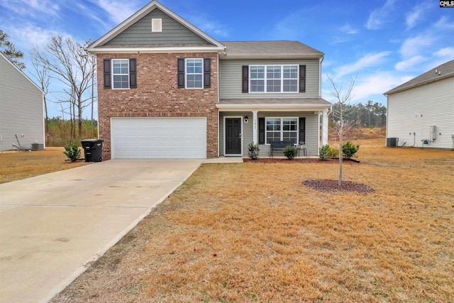 view of front of home featuring cooling unit, a porch, a garage, and a front yard