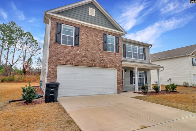 view of front of home featuring a garage and a front lawn