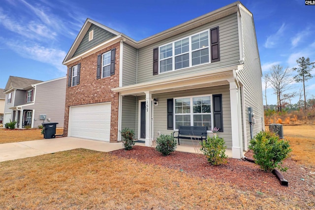 view of front of house featuring a garage, a front yard, covered porch, and cooling unit