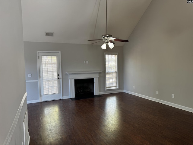 unfurnished living room with high vaulted ceiling, dark hardwood / wood-style floors, and ceiling fan