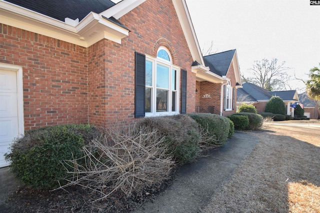 view of side of home with a garage