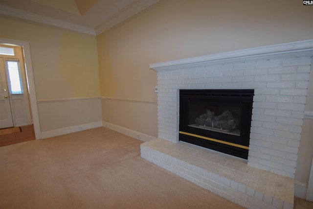 interior details with crown molding, carpet, and a fireplace