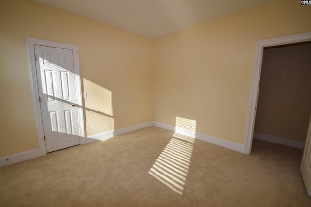 empty room with light colored carpet