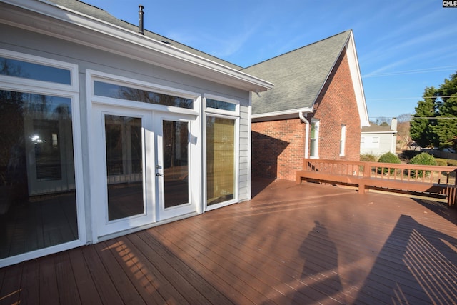 wooden deck featuring french doors