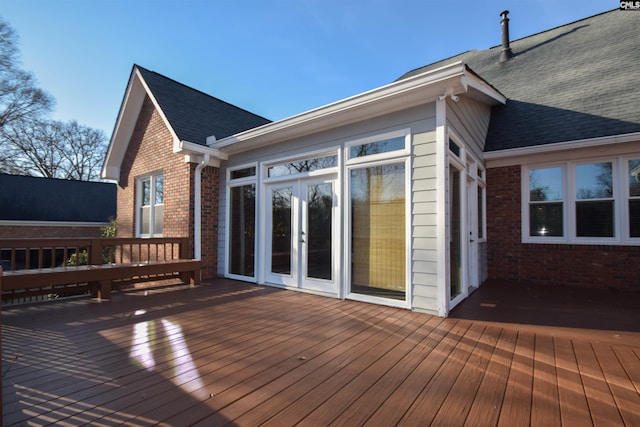 wooden deck featuring french doors