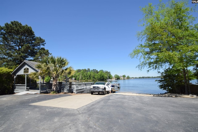 view of parking featuring a water view