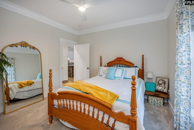 carpeted bedroom featuring crown molding, baseboards, and ceiling fan