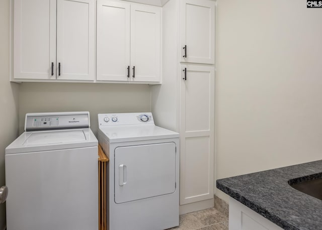 laundry area featuring cabinet space and washing machine and clothes dryer