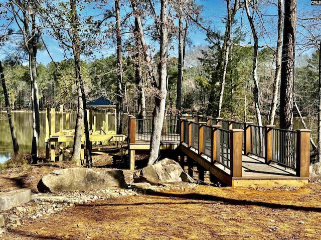 view of playground featuring a view of trees