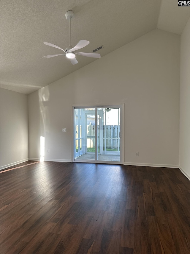 spare room with a textured ceiling, high vaulted ceiling, dark hardwood / wood-style floors, and ceiling fan