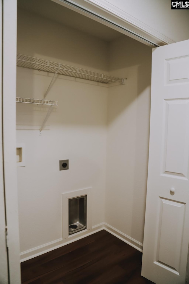 washroom with dark hardwood / wood-style floors and hookup for an electric dryer