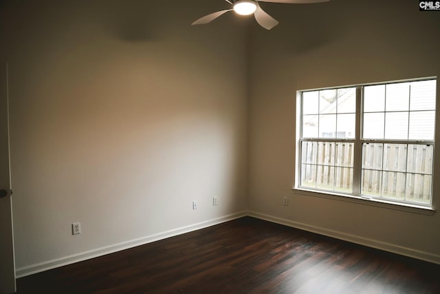 unfurnished room with ceiling fan and dark hardwood / wood-style flooring