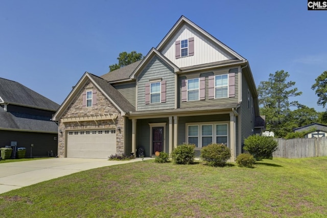 craftsman-style house featuring a garage and a front lawn