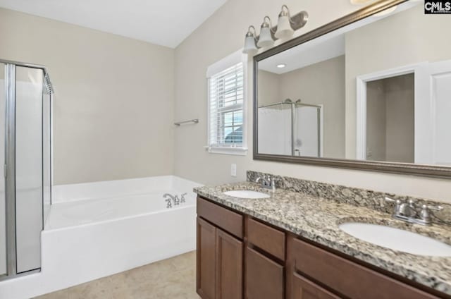 bathroom featuring vanity and shower with separate bathtub