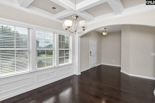 interior space featuring a chandelier, dark hardwood / wood-style flooring, coffered ceiling, crown molding, and beam ceiling