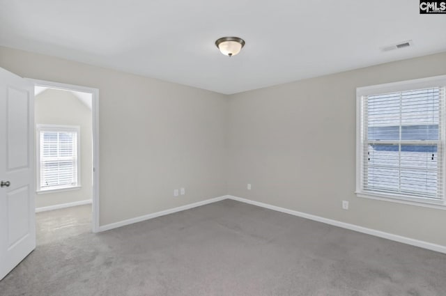 empty room featuring light colored carpet