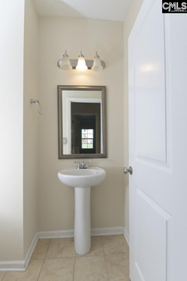 bathroom with tile patterned floors