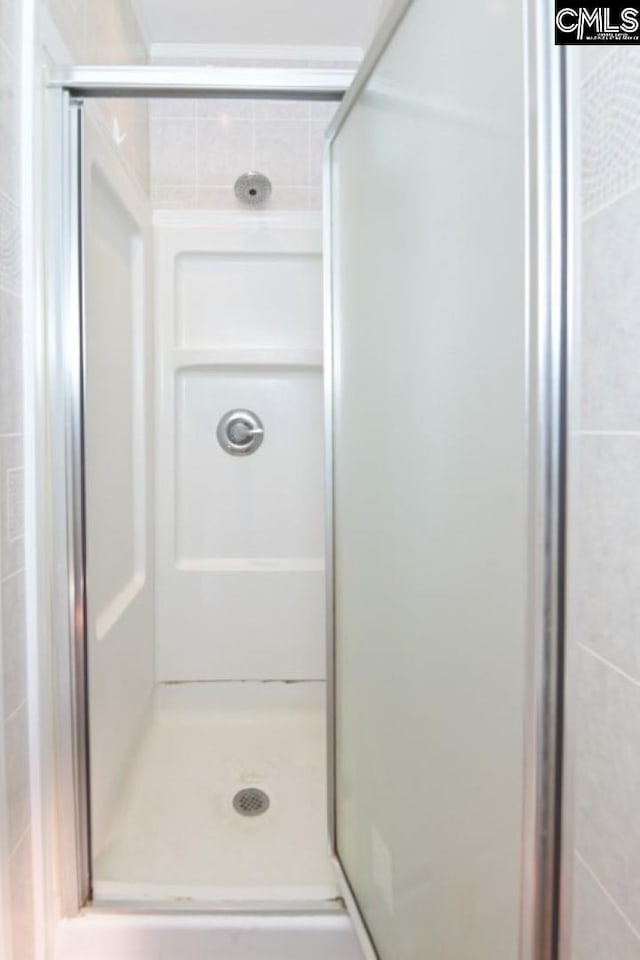 bathroom featuring an enclosed shower