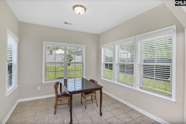 home office featuring light tile patterned flooring