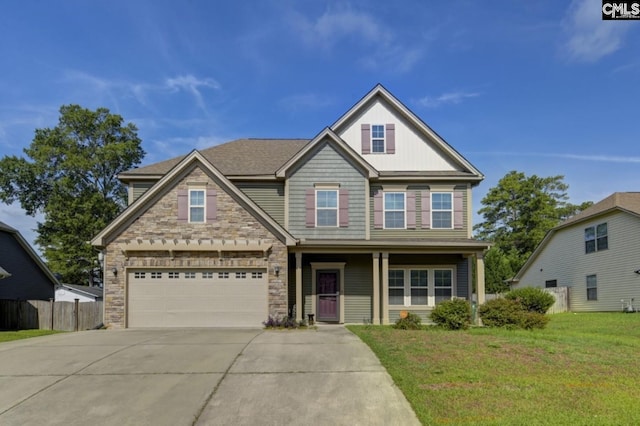 craftsman house with a garage and a front yard