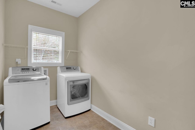 washroom with independent washer and dryer