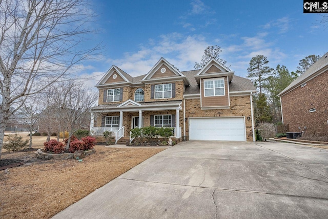 view of front facade featuring a garage and a porch