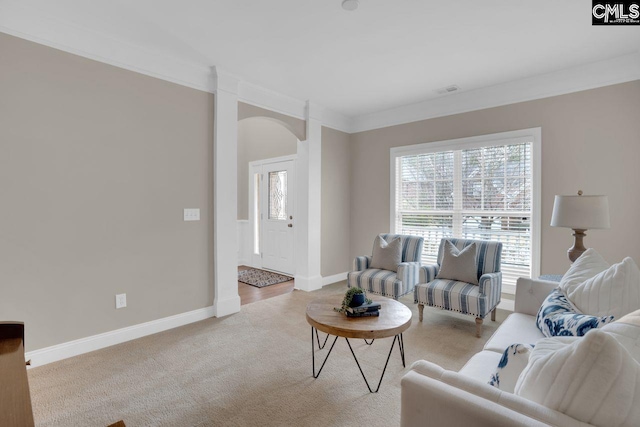 living room with light carpet and ornamental molding