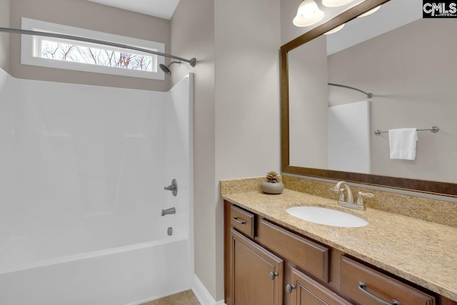 bathroom with vanity and  shower combination