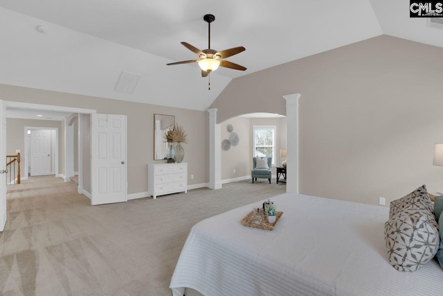 carpeted bedroom featuring ceiling fan, vaulted ceiling, and ornate columns