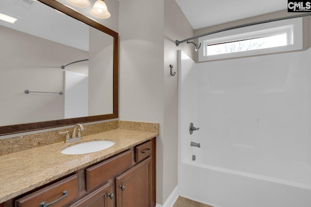 bathroom with vanity and bathing tub / shower combination