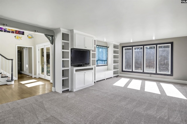 unfurnished living room featuring carpet