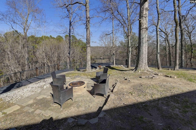 view of yard featuring a fire pit and a patio area