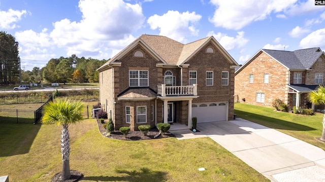 view of front of house featuring a garage and a front lawn