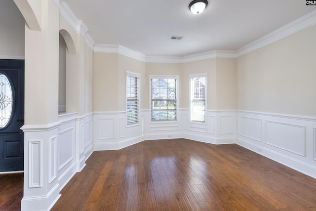 unfurnished room with crown molding and dark hardwood / wood-style floors