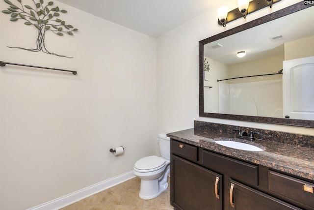 bathroom with tile patterned flooring, a shower, vanity, and toilet