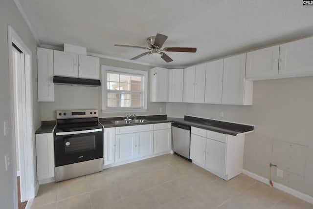 kitchen featuring white cabinetry, appliances with stainless steel finishes, sink, and light tile patterned floors