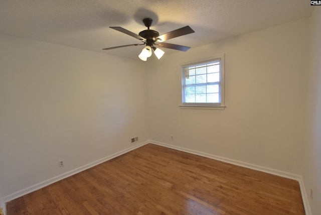 unfurnished room featuring hardwood / wood-style floors, a textured ceiling, and ceiling fan