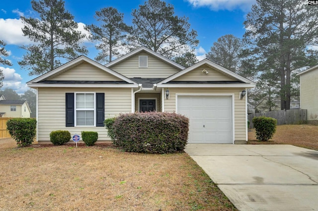 view of front facade featuring a garage and a front lawn