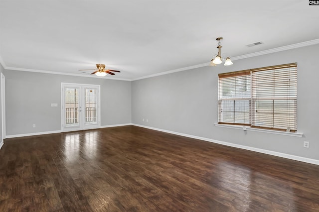 unfurnished room featuring french doors, a healthy amount of sunlight, crown molding, and dark wood-type flooring