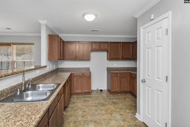 kitchen with sink and crown molding