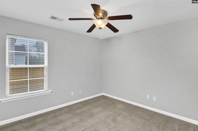 carpeted empty room with ceiling fan