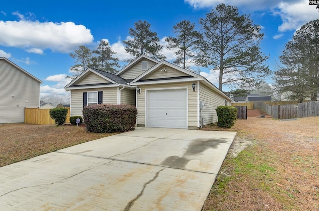 view of front of home featuring a garage and a front lawn