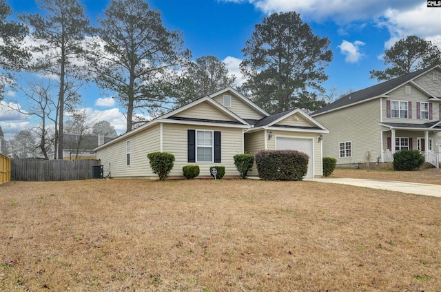 view of front of house featuring a garage, a front lawn, and central air condition unit