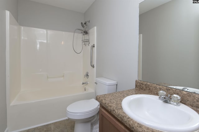 full bathroom with vanity, tile patterned floors, toilet, and washtub / shower combination