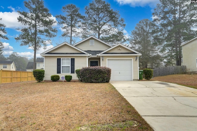 view of front of home with a garage and a front lawn