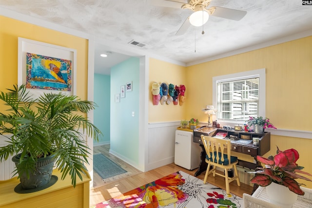 office featuring ceiling fan and light hardwood / wood-style floors